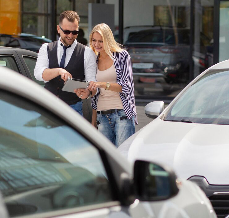 happy-customer-car-dealership-with-seller_23-2149106202